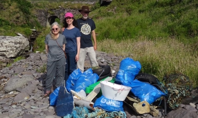 Laura Evans, Heather Evans and Eric Evans, with the pile of trash they collected with Rosemary Hill in Count Kerry, Ireland.(Photo courtesy Heather Evans)