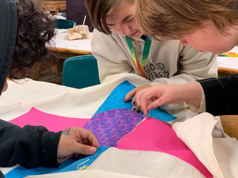 Sewing flags. Photo courtesy OUT Maine