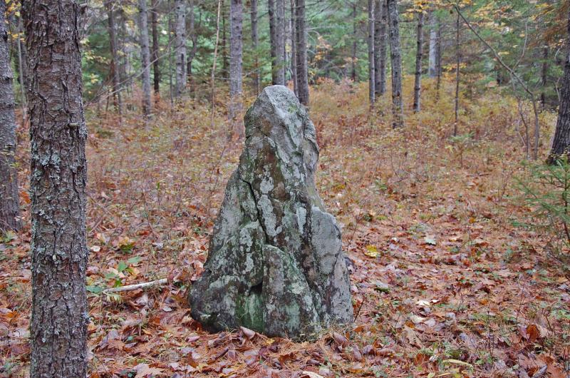 A 4-foot-tall standing stone with traces of red staining is located in a flat area next to the Ducktrap River. (Photo courtesy Dennis Cerrotti)