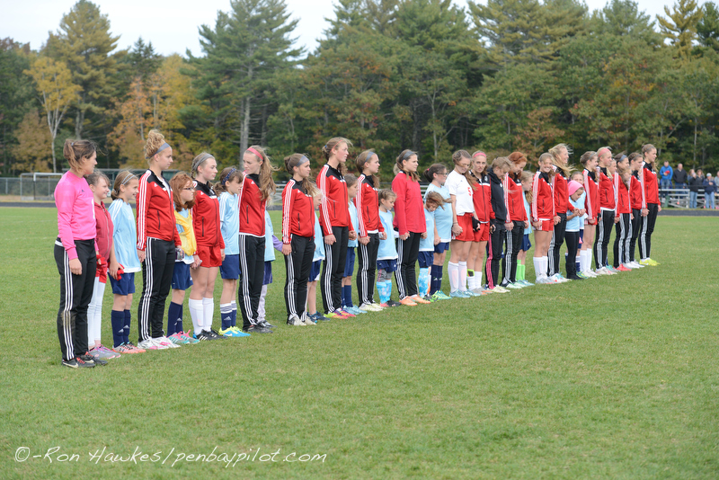 Camden Hills girls soccer players on the field prior to a varsity game with area youth players. (File Photo/Ron Hawkes)