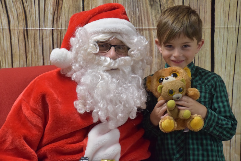 Kellen Purington brings along his teddy bears to visit with Santa. (Photo courtesy Thomaston Grammar School)