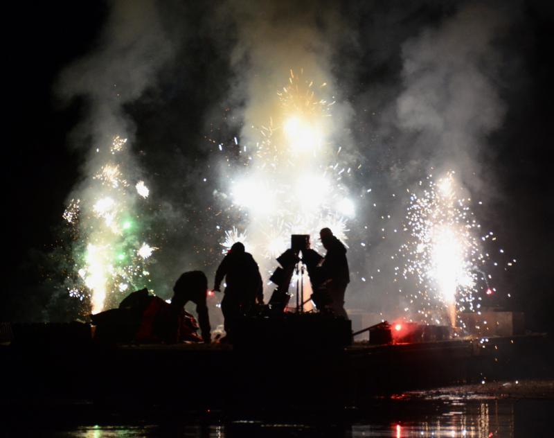 Donnie Heald, Nick Wade and Sam Berry, on the floats lighting the fireworks. (Photo by Lynda Clancy)