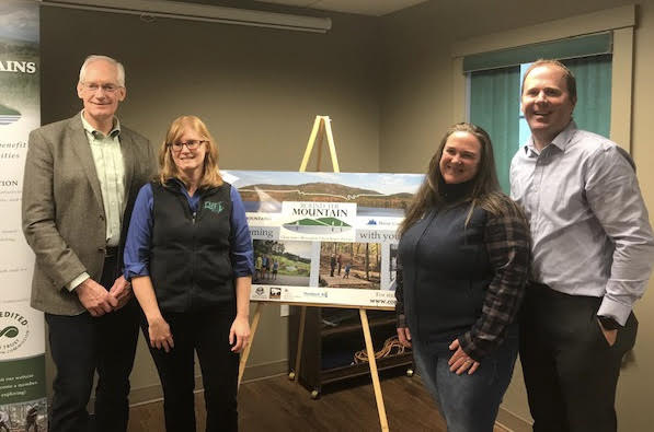 Rock Knowlton, president Maine Water Company; Sarah Demers; Heidi Baker, Land for Maine’s Future; and Ian Stewart, executive director, Coastal Mountains Land Trust. (Photo courtesy Coastal Mountains Land Trust)