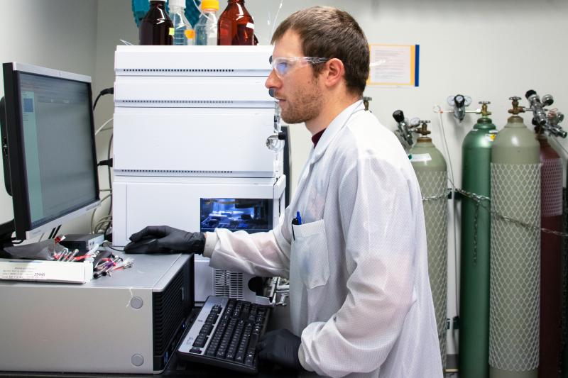 Research Associate Craig Burnell analyzes a shellfish sample for toxins at Bigelow Laboratory for Ocean Sciences. A new publication reports how researchers can use deep learning algorithms to forecast shellfish toxicity, just like meteorologists forecast the weather. Courtesy of Bigelow Laboratory for Ocean Sciences