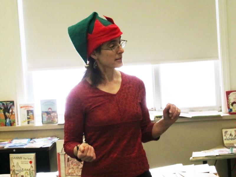 Ms. West explains to an eager audience how to go about choosing their books. (Photo by Kay Stephens)