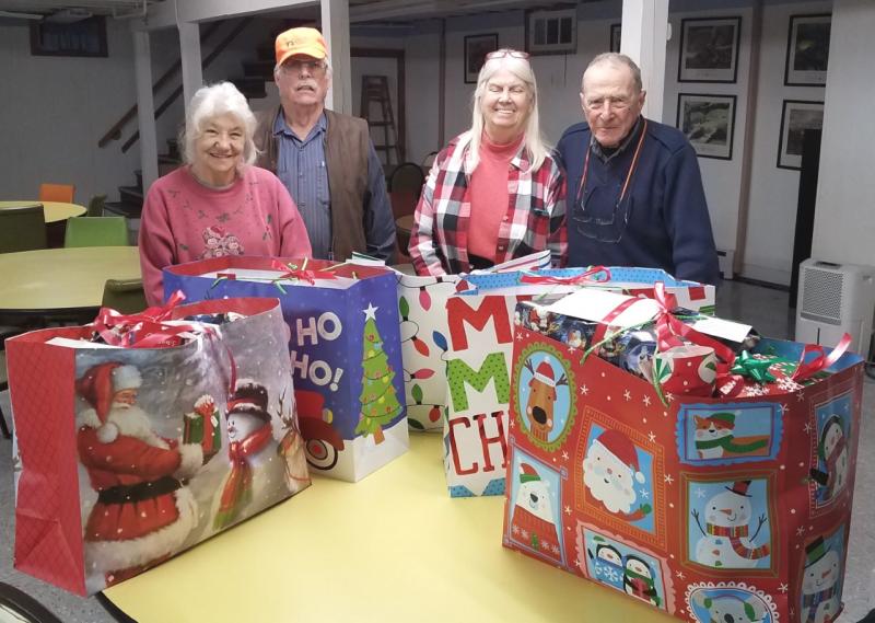 Post 30 volunteers who wrapped holiday presents for veterans at the Maine Veterans’ Home in Augusta are from left, Judy and Norman Carver, Connie Sukeforth, and Geof Chapman. Absent from the photo is Jeff Sukeforth who was the photographer. (Photo courtesy of Jeff Sukeforth)