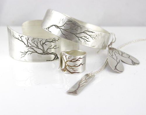 Her hand-engaved tree jewelry. Photo courtesy of Felicia Cinquegrana