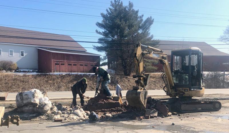 Bruce Colson and his crew work to remove the old “Helm” signpost along Route 1 in Rockport on Feb. 24. (Photo: Lynda Clancy)