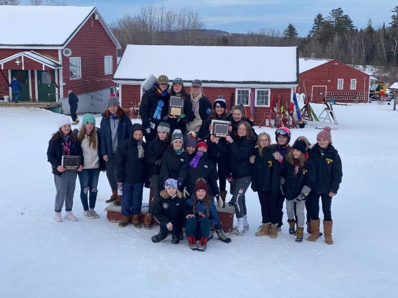 On center podium, in back, are Camden Snow Bowl skiers Greer Lafiura, Zola Roberts and Lily Stowe. Next row includes Ula Durow, Grace Decubellis, Piper Urey, Maggie Metzler, Katie Grace. Front row includes Estelle Chase and Olive Walker. (Courtesy Weber Roberts)