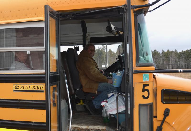 Runner Martha Heal and driver Patrick Garret have Chestnut Street and Route 1 delivery. (Photo by Lynda Clancy)