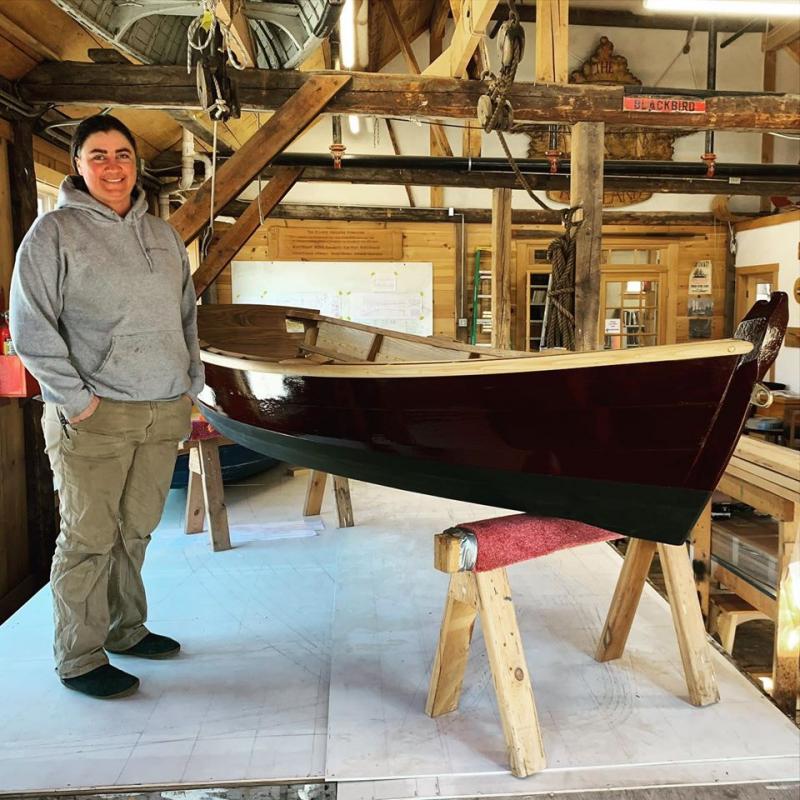 Emma and her completed Susan Skiff. (Photo by Nate Hathaway)