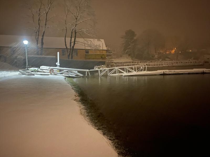 Snow and water rise against the rehabilitated American Boat House at the head of Camden Harbor. (Photo by Alison McKellar)