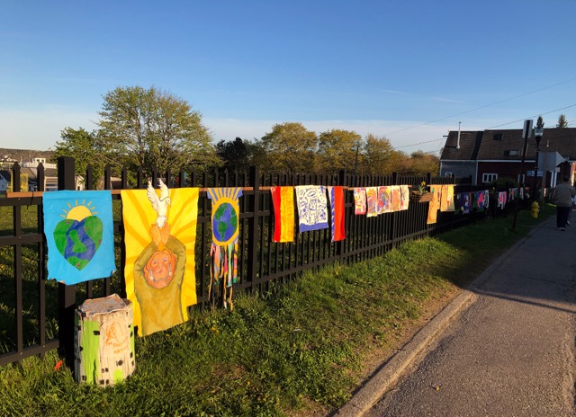 Students are Riley School hang their messages of hope and creating sparks of light amidst these shadowy days on a downtown Rockland fence. (Photo courtesy Riley School)