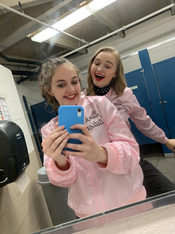Emily Boynton and Chloè Courant taking a mirror selfie before Oceanside’s Fall Musical of Grease. (Photo courtesy Emily Boynton)