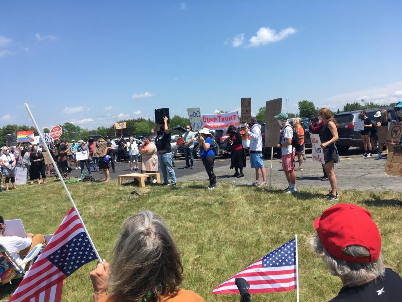 At first the crowd of over 1,000 was content to listen to the speakers. (Photo courtesy Molly Mulhern)