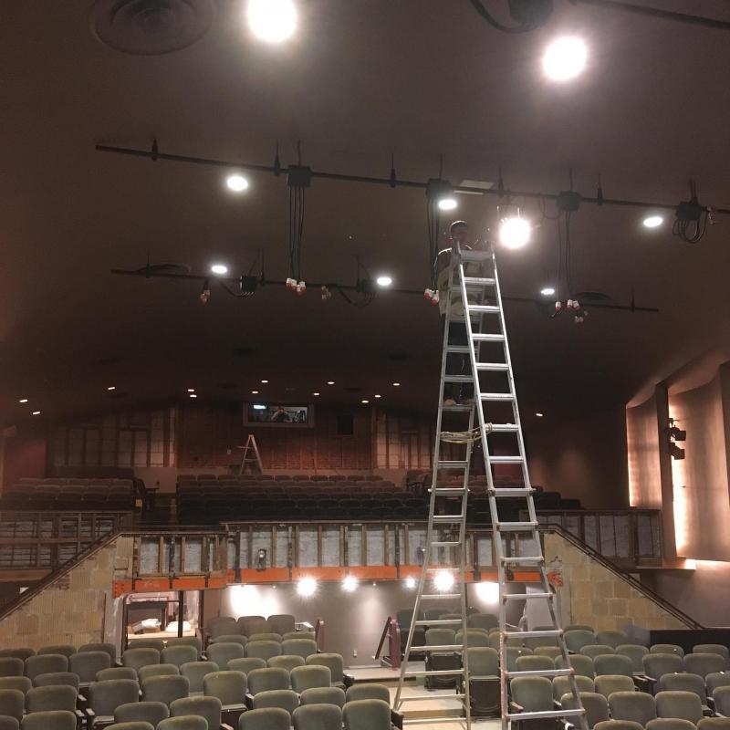 Hanging stage lights (volunteers Matthew Kopishke; Colin Sutch). (Photo courtesy of Waldo Theatre)