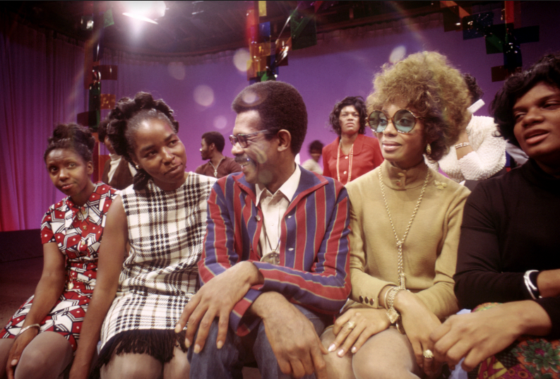 Host/Producer/Creator of the television show SOUL!, Ellis Haizlip, is surrounded by members of the J.C. White Choir just after their performance on the show. (Courtesy Shoes in the Bed Productions)