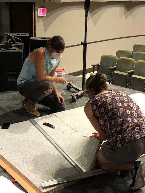 Family team of volunteers cutting acoustic panels (volunteers Cat and Brynna Skov). (Photo courtesy of Waldo Theatre)