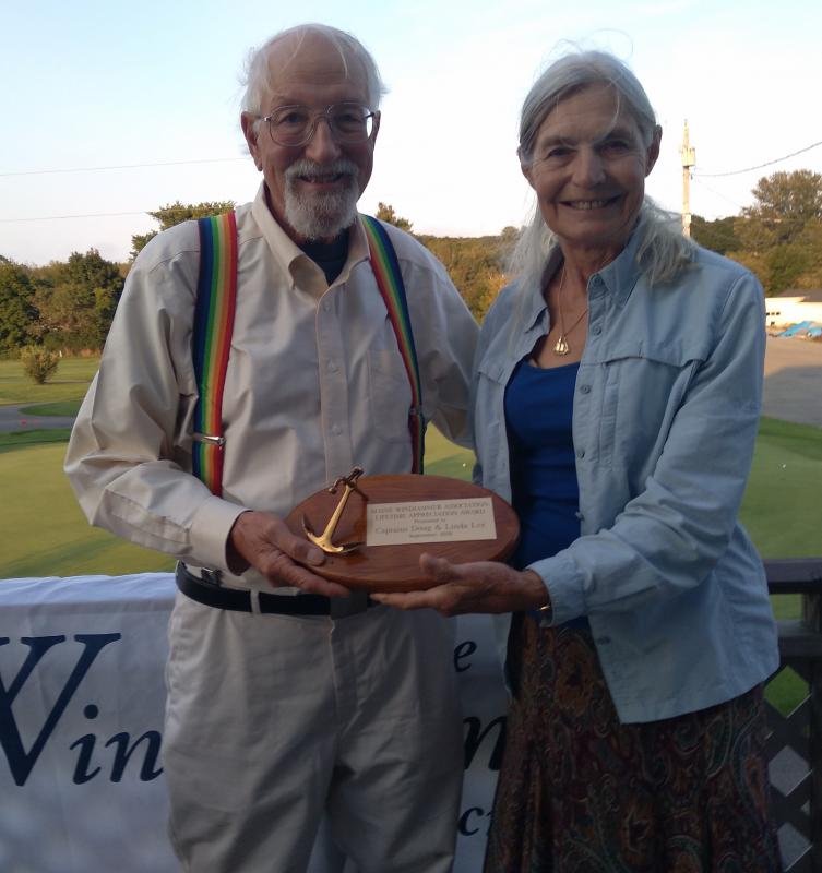 Captains Doug and Linda Lee pose with the Lifetime Achievement Award. (Photo credit Maine Windjammer Association)