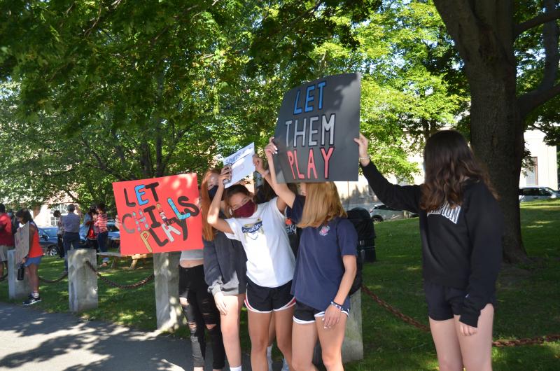 Camden Hills Regional High School students rally in downtown Camden Sept. 1, advocating to play in the state’s fall and winter schedule of competitive high school games. (Photo by Lynda Clancy)
