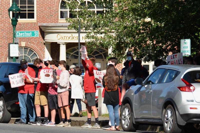 Camden Hills Regional High School students rally in downtown Camden Sept. 1, advocating to play in the state’s fall and winter schedule of competitive high school games. (Photo by Lynda Clancy)