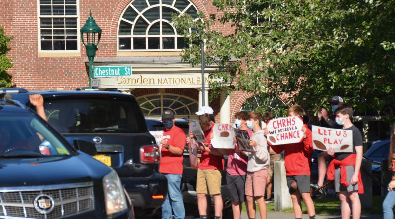 Camden Hills Regional High School students rally in downtown Camden Sept. 1, advocating to play in the state’s fall and winter schedule of competitive high school games. (Photo by Lynda Clancy)