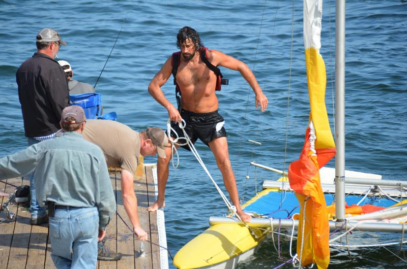 Sailor Brendan Browne was in the cold Maine waters for some time, trying to upright his capsized boat. (Photo by Lynda Clancy)