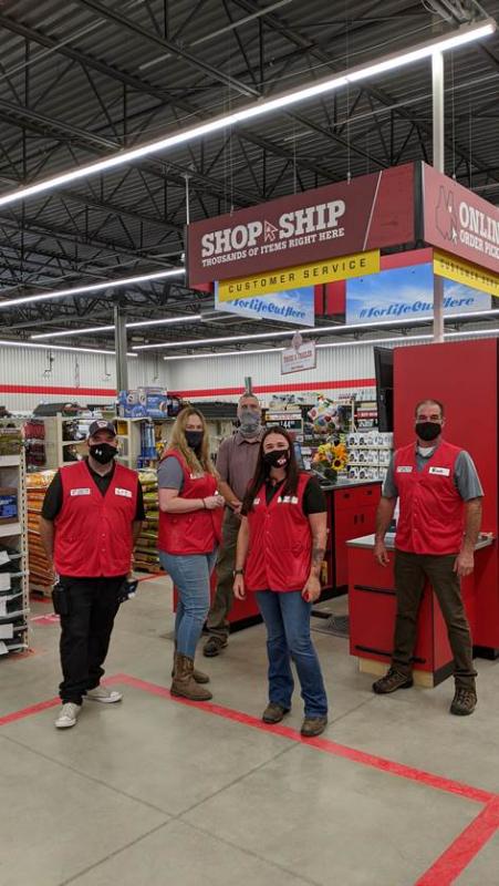 Team Members pose inside the store, with store manager Tressa Sullins in the front center. (Photo courtesy Belfast Chamber of Commerce)