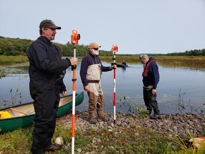Quantabacook Lake dam, Searsmont. (left to right) Scott Craig, fisheries biologist U.S. Fish & Wildlife Service, Terry Young, President of Georges River T.U., and Mark Pasterczyk of ME Dept. of Marine Resources. (Steve Hirshberg photo)