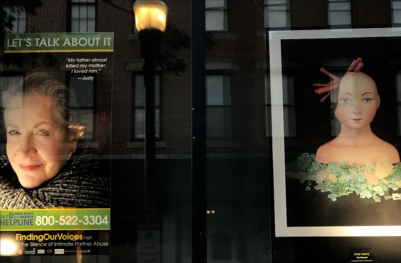 One of six windows the Farnsworth Museum is devoting to Finding Our Voices. A "Let's Talk About It" banner with Judy’s quote, "My father almost killed my mother. I loved him." next to a painting “Shattered” by Amy Lowry. Photo courtesy Finding Our Voices