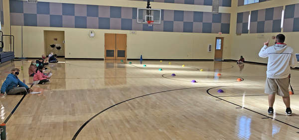 ym teacher Bradley Deuring, right, conducts a socially distanced gym class at Capt. Albert W. Stevens School. (Courtesy of: Nancy Nickerson)