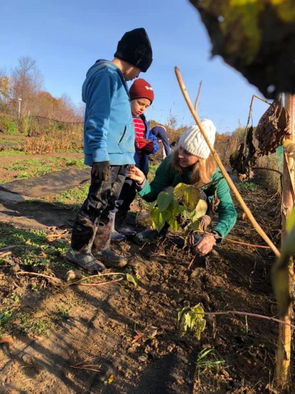 Garden coordinator, Millie, works with children at Hope Elementary. (Photo courtesy Maine Environmental Education Association (MEEA))