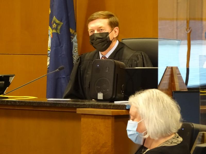 Justice Robert Murray speaks to the courtroom as he prepares to hand down his sentence. photo by Erica Thoms)