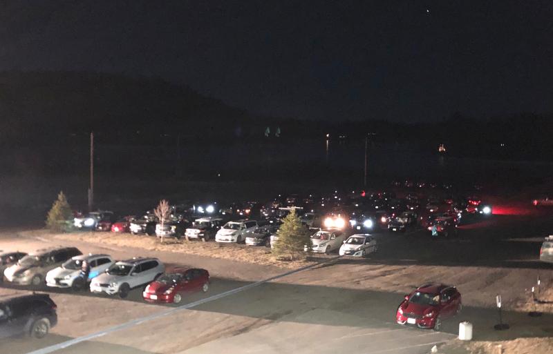 That’s no average parking lot on a Monday night. It’s the Camden Snow Bowl, where Camden residents gathered Jan. 25, 2021 for a special town meeting, voting from their vehicles and tuning into the discussions on 88.3 FM.