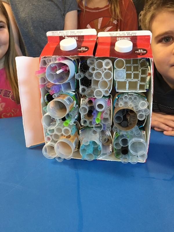 Nine 'bee apartments' assembled into a multi-unit 'bee hotel' to be used to invite solitary bees to the school garden (Photo courtesy Lynn Snow)