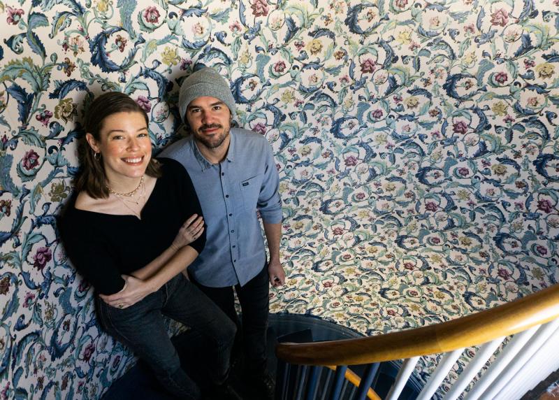 "In the process of painting the entryway trim with Hale Navy, the same color that Andrew and Shannon had chosen for the front of the building." Photo courtesy Elizabeth Soule
