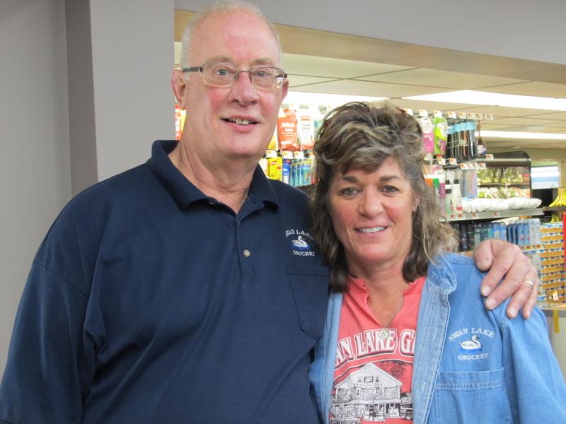 Rob and Deb Newcomb, owners of Swan Lake Grocery in Swanville. Note: masks temporarily removed for the photo. Photo by Kay Stephens