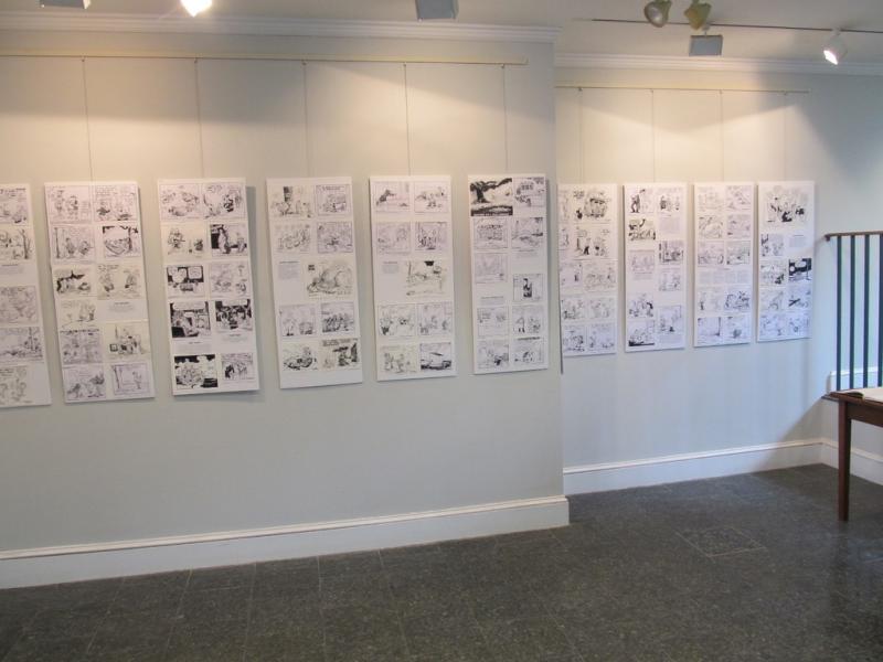 Douglas Coffin’s editorial cartoons at Belfast Free Library. Photo by Kay Stephens