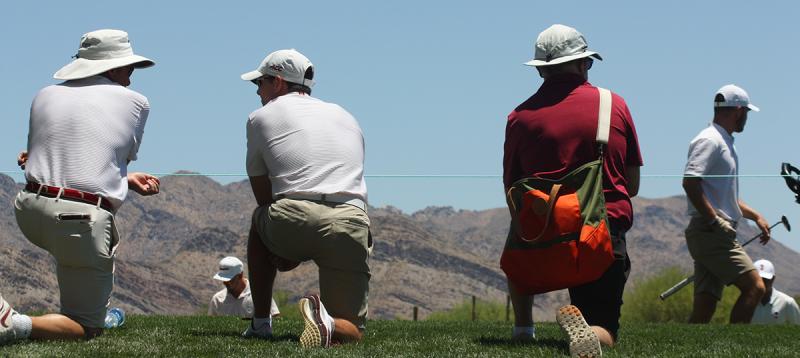 Cole Anderson seen walking, far right, during opening day of the NCAA Division I men’s golf national championship. Two of his Florida State coaches are in white while his father, Derek, is in red. (Courtesy Holly S. Anderson)