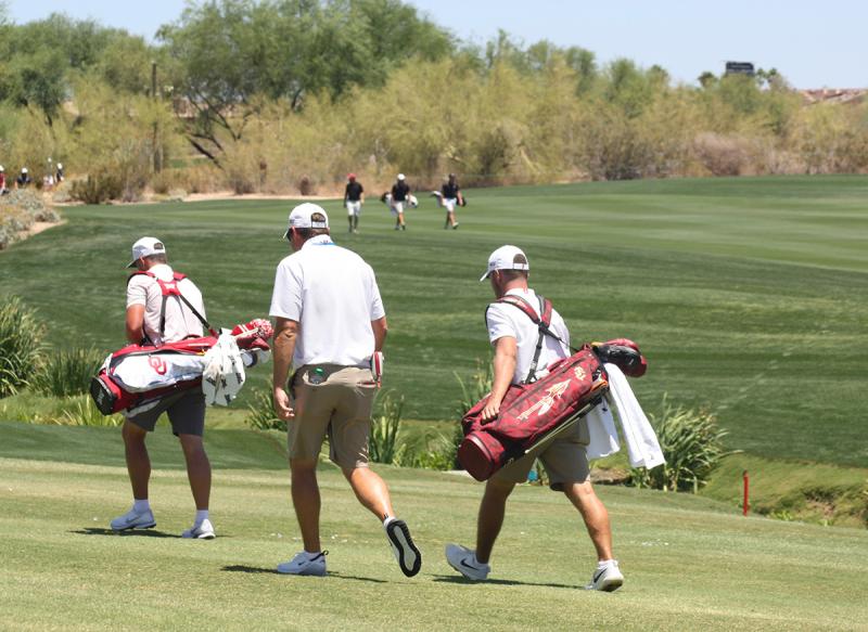 Cole Anderson, back right, walking the course next to his coach during opening day of the NCAA Division I men’s golf national championship. (Courtesy Holly S. Anderson)