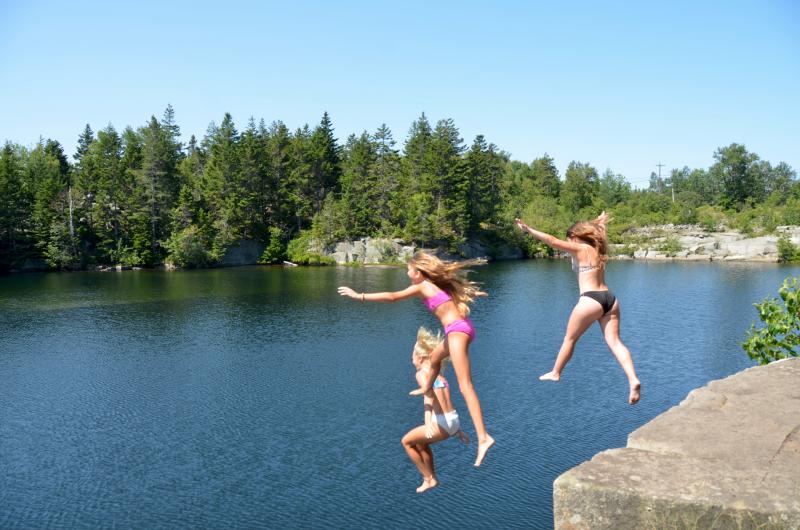 Avery, Brynn and Cayla jump into Booth’s Quarry on Vinalhaven.