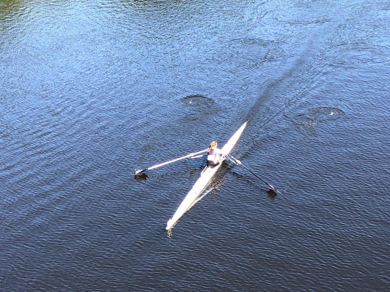 Maggie Gill rowing to the finish line. (Courtesy Tris Coburn and Peter Piconi)