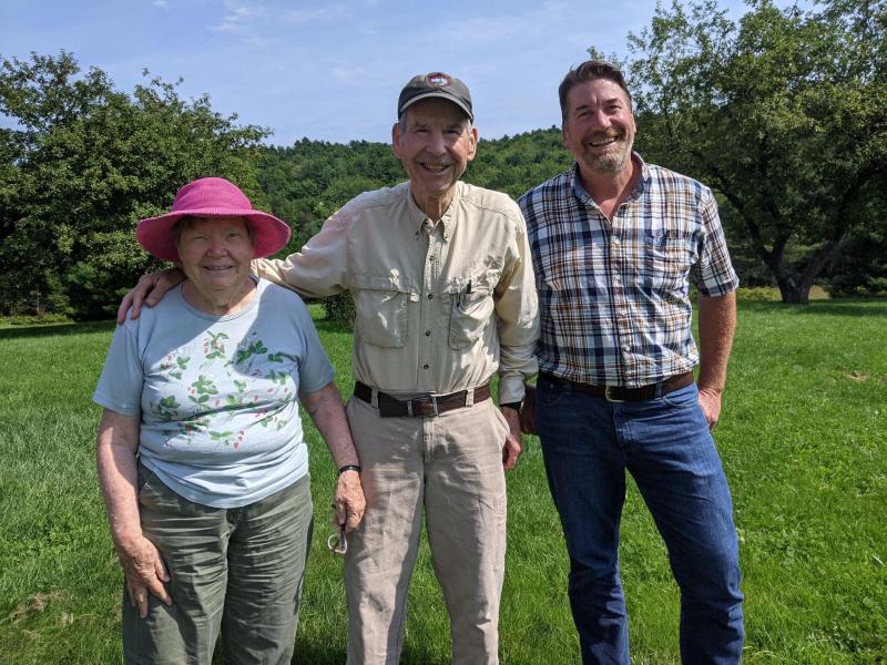 Sandra Barth, Nick Barth, and Midcoast Conservancy Executive Director Pete Nichols; the Barth family established the Reverend Barth Memorial Forest. (Photo courtesy Midcoast Conservancy)