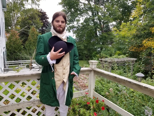 Jack Deslippe, AmeriCorps member with the Game Loft/I Know ME program, poses at Grove Cemetery where he recently portrayed John Cochrane, a wealthy proprietor who was a participant in the Boston Tea Party 1773. (Photo courtesy I Know ME)