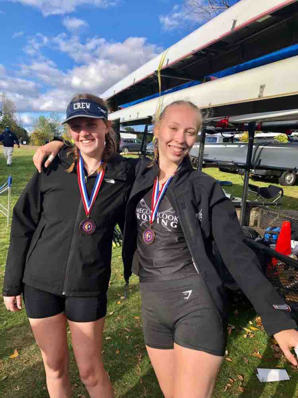 Maggie Gill, left, and Iselin Bratz victorious in their third place finish.