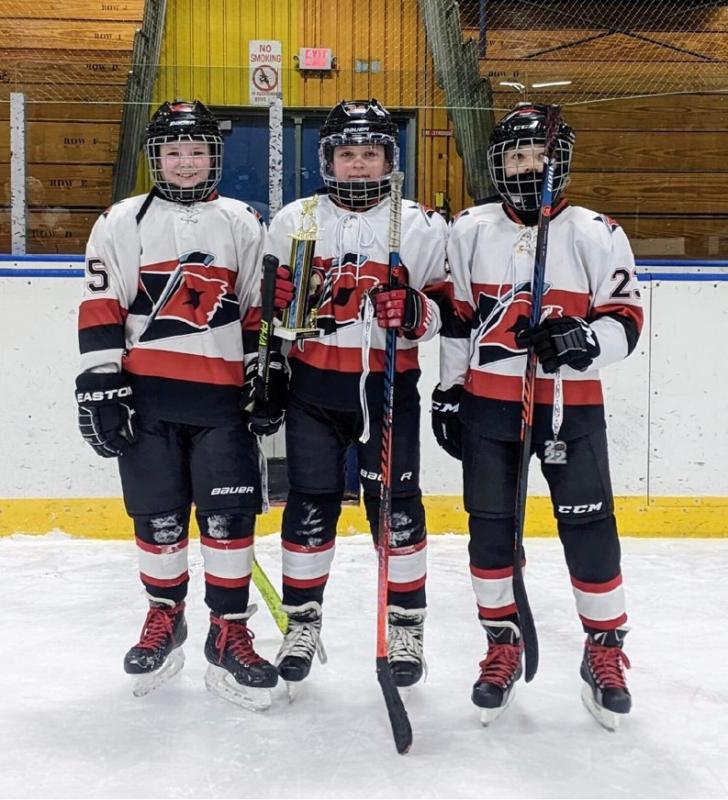 JD Corbett, Devon Kuplinski and Spencer Hilchey accept the runner up trophy at the tournament. (Courtesy Paul Kuplinski)