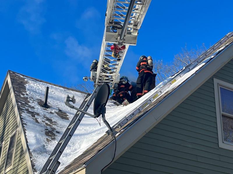 On Jan. 31, the Rockport Fire Department responded to its first chimney fire in 2022. Rockport firefighters could not reach the chimney by using the department’s regular ladders due to the home’s sloping roof design, so the Camden Fire Department provided mutual aid with its ladder truck. (Photo courtesy Rockport Fire Department)