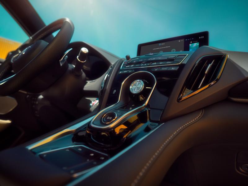 Honda’s unique gear shifter sits higher in the RDX, which somehow makes it easier to use. The upper knob is the drive-mode selector; the flat panel at the bottom is the computer touchpad, which is in fact a bit touchy.
