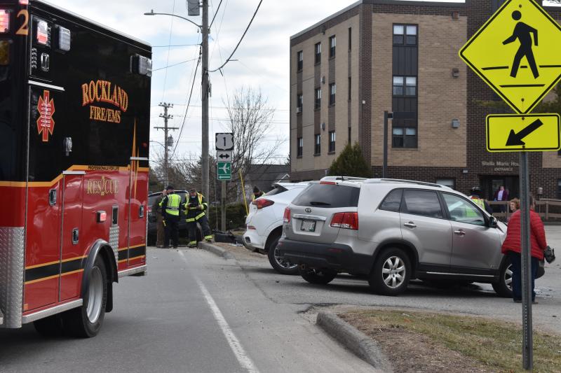 Despite all vehicles coming to a stop on the side of Broadway, Rockland firefighters had to sweep debris, including pieces of tire, from the middle of the road. (Photo by Sarah Thompson)
