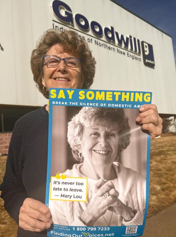 Mary Lou Smith with her Say Something poster, one of 400-plus posters featuring 43 named, Maine survivors of domestic abuse displayed in every Goodwill dressing room and employee break-room in Maine, New Hampshire, and northern Vermont. (Photo courtesy Finding Our Voices)